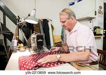 Tilburg, Netherlands. The 72 year old ´Boy´ still works as an independent upholsterer in his own workshop, down town Tilburg, where he refurbishes and upholsters all kinds of chairs. View Large Photo Image Stock Photo - Tilburg, Netherlands. The 72 year old ´Boy´ still works as an independent upholsterer in his own workshop, down town Tilburg, where he refurbishes and upholsters all kinds of chairs.. Fotosearch