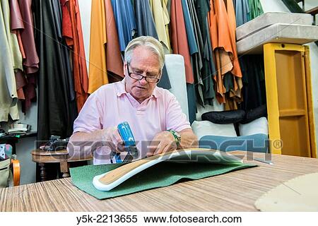 Tilburg, Netherlands. The 72 year old ´Boy´ still works as an independent upholsterer in his own workshop, down town Tilburg, where he refurbishes and upholsters all kinds of chairs. View Large Photo Image Stock Photography - Tilburg, Netherlands. The 72 year old ´Boy´ still works as an independent upholsterer in his own workshop, down town Tilburg, where he refurbishes and upholsters all kinds of chairs.. Fotosearch
