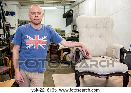 Tilburg, Netherlands. Werner assistes his male partner Josef, who works as an independent upholsterer in his own workshop, down town Tilburg, where he refurbishes and upholsters all kinds of chairs. View Large Photo Image Stock Photography - Tilburg, Netherlands. Werner assistes his male partner Josef, who works as an independent upholsterer in his own workshop, down town Tilburg, where he refurbishes and upholsters all kinds of chairs.. Fotosearch