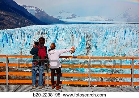 Tourist taking pictures. Mini trekking. Walk on the glacier with crampons. Perito Moreno glacier. Los Glaciares National Park. Near El Calafate. Santa Cruz province. Patagonia. Argentina. View Large Photo Image Stock Photo - Tourist taking pictures. Mini trekking. Walk on the glacier with crampons. Perito Moreno glacier. Los Glaciares National Park. Near El Calafate. Santa Cruz province. Patagonia. Argentina.. Fotosearch