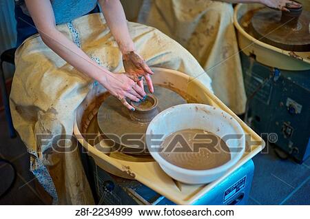 Tourists learn the arts of pottery on a studio on Sannen-zaka Street, which leads up to Kyoto´s famous Kiyomizudera Temple. View Large Photo Image Stock Photo - Tourists learn the arts of pottery on a studio on Sannen-zaka Street, which leads up to Kyoto´s famous Kiyomizudera Temple.. Fotosearch