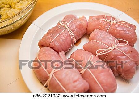 Stock Image - turkey parmesan preparation.. Fotosearch