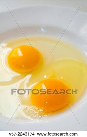 Picture - Two eggs. Close view.. Fotosearch