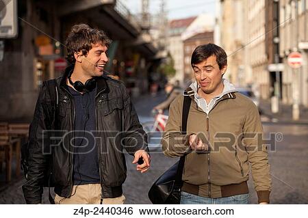Two young men in a street. View Large Photo Image Stock Photograph - Two young men in a street.. Fotosearch