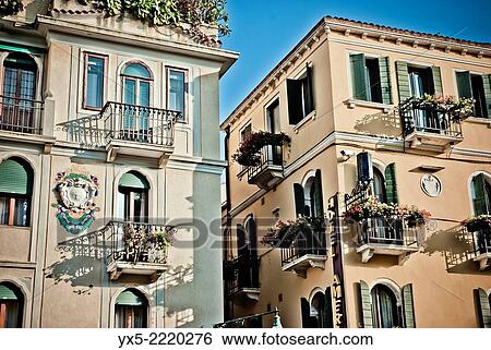 Stock Photograph - Typical Venetian windows, shutters and balconies.. Fotosearch