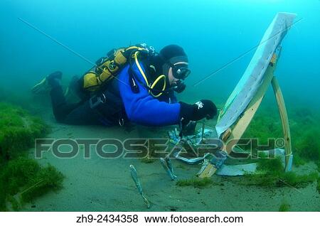 Underwater artist Yuriy Alexeev (Yuri Alekseev) paints a picture under water. Lake Baikal, Listvyanka, Irkutsky District, Irkutsk Oblast, Siberia, Russia, Eurasia. View Large Photo Image Stock Photo - Underwater artist Yuriy Alexeev (Yuri Alekseev) paints a picture under water. Lake Baikal, Listvyanka, Irkutsky District, Irkutsk Oblast, Siberia, Russia, Eurasia.. Fotosearch