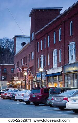 Stock Image - USA, Vermont, White River Junction, buildings on South Main Street, evening.. Fotosearch