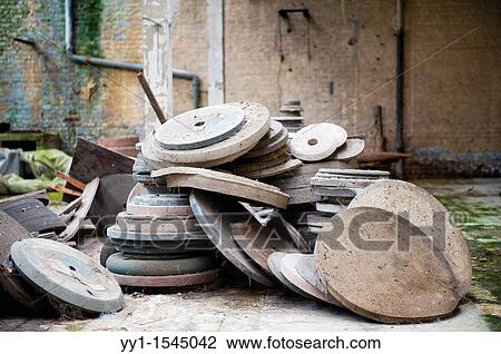 Val Saint Lambert, Belgium. Left behind circular production tools in an abandoned factory for luxurious crystal products. View Large Photo Image Stock Image - Val Saint Lambert, Belgium. Left behind circular production tools in an abandoned factory for luxurious crystal products.. Fotosearch