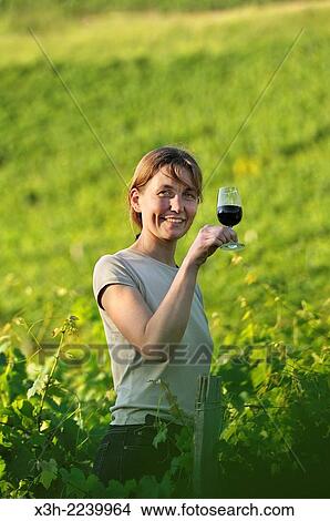 Veronique Dupasquier, wine grower, tasting wine in the vineyard at Jongieux, Savoie department, Rhone-Alpes region, France, Europe. View Large Photo Image Picture - Veronique Dupasquier, wine grower, tasting wine in the vineyard at Jongieux, Savoie department, Rhone-Alpes region, France, Europe.. Fotosearch