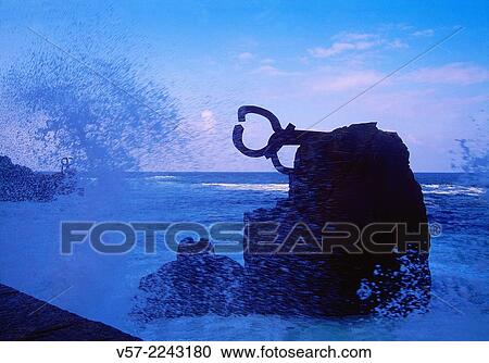 Stock Image - Wave beating against Peine del Viento sculpture. San Sebastian, Spain.. Fotosearch
