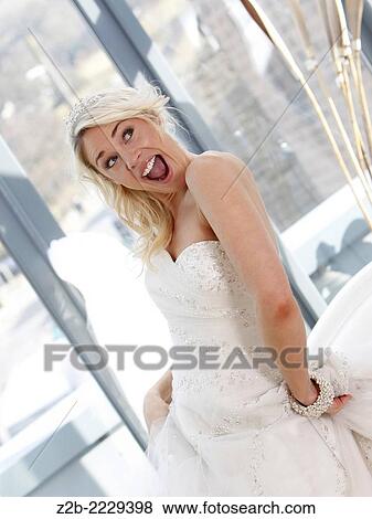 Wedding dress worn by a model View Large Photo Image Stock Photo - Wedding dress worn by a model. Fotosearch