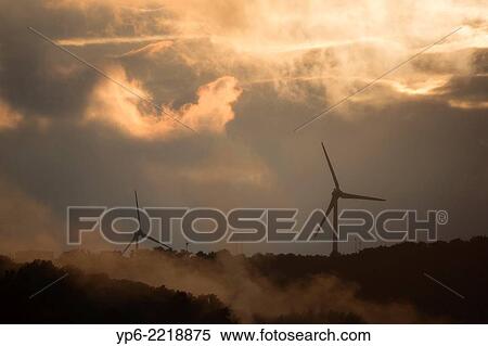 wind turbines and clouds at sunset, Trier, Rhineland-Palatinate, Germany. View Large Photo Image Stock Photography - wind turbines and clouds at sunset, Trier, Rhineland-Palatinate, Germany.. Fotosearch