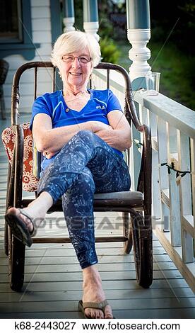 woman, 73 years, in a rocking chair on a porch View Large Photo Image Stock Photo - woman, 73 years, in a rocking chair on a porch. Fotosearch