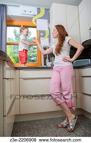 woman with a 1, 5 years old boy in the kitchen. View Large Photo Image Stock Photo - woman with a 1, 5 years old boy in the kitchen.. Fotosearch