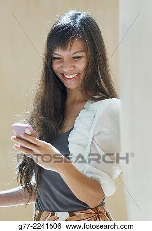 Woman with cell phone. View Large Photo Image Stock Photograph - Woman with cell phone.. Fotosearch
