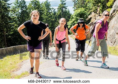 women and girls walk up hill on Saturna Island, Gulf Islands, British Columbia, Canada. View Large Photo Image Stock Photo - women and girls walk up hill on Saturna Island, Gulf Islands, British Columbia, Canada.. Fotosearch
