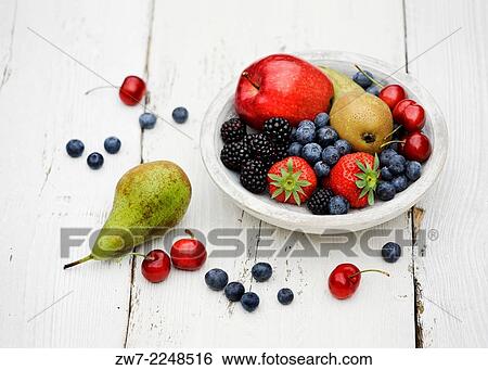 Wooden bowl filled and overflowing with fresh fruit Red Delicious Apples Conference Pears Cherries Blackberries Strawberries and Blueberries. View Large Photo Image Stock Photograph - Wooden bowl filled and overflowing with fresh fruit Red Delicious Apples Conference Pears Cherries Blackberries Strawberries and Blueberries.. Fotosearch
