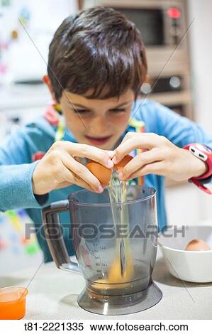 Young boy learning to cook, in the kitchen Valencia, Spain,. View Large Photo Image Stock Photography - Young boy learning to cook, in the kitchen Valencia, Spain,.. Fotosearch