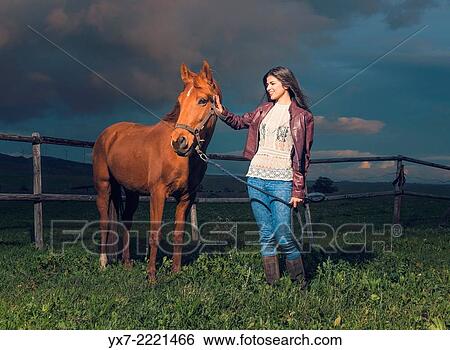 Stock Photograph - Young woman with her Horse. Tarifa, cadiz, Andalusia, Spain.. Fotosearch