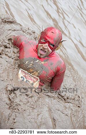 A contestant dresses in 'fancy dress' for The Tough Guy contest. View Large Photo Image Stock Image - A contestant dresses in 'fancy dress' for The Tough Guy contest.. Fotosearch