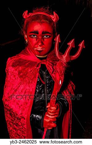 A Young Mixed Race Girl Dressed Up As A Devil, Halloween, Sussex, UK. View Large Photo Image Stock Photography - A Young Mixed Race Girl Dressed Up As A Devil, Halloween, Sussex, UK.. Fotosearch