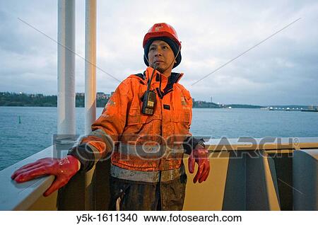 Stock Image - An Indonesian seaman or sailor on the container-vessel MV Flintercape, during a journey from Rotterdam, Netherlands, to Sundsvall, Sweden. The man is an Â´Able SeamanÂ´, who generally works on deck.. Fotosearch
