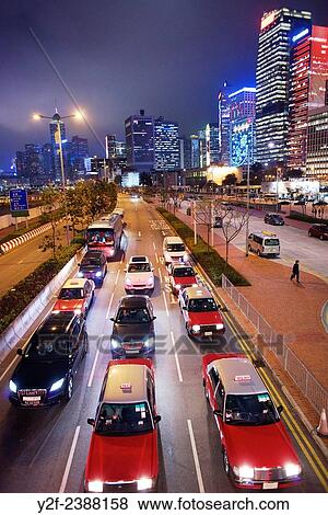 cars wait at traffic lights with Hong Kong skyline in the background. View Large Photo Image Stock Photo - cars wait at traffic lights with Hong Kong skyline in the background.. Fotosearch