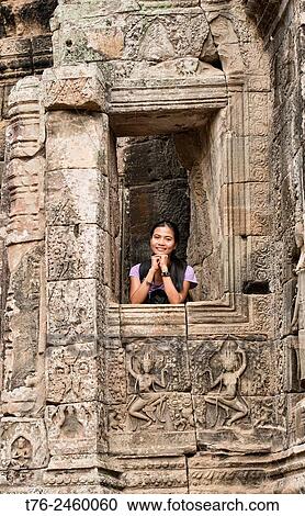 Contemplating the Bayon temple at Angkor Wat in Siem Reap, Cambodia. View Large Photo Image Stock Image - Contemplating the Bayon temple at Angkor Wat in Siem Reap, Cambodia.. Fotosearch