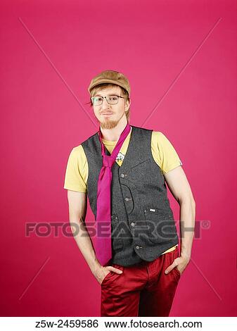 Expressive hipster wearing a vest and pink tie, pink background and studio shot. View Large Photo Image Stock Photograph - Expressive hipster wearing a vest and pink tie, pink background and studio shot.. Fotosearch