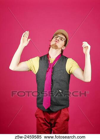 Expressive hipster wearing a vest and pink tie, pink background and studio shot. View Large Photo Image Stock Photography - Expressive hipster wearing a vest and pink tie, pink background and studio shot.. Fotosearch