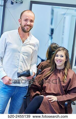 Hairdresser doing hairstyle a woman. Hair dryer. Hairdressers and Beauty Clinic. Hair salon. View Large Photo Image Stock Photo - Hairdresser doing hairstyle a woman. Hair dryer. Hairdressers and Beauty Clinic. Hair salon.. Fotosearch