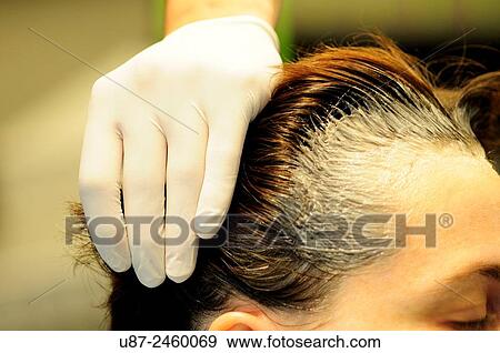 Stock Photo - Hairstylist Dyeing Hair at Hair Salon.... Fotosearch