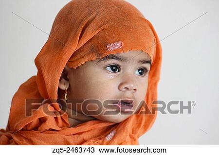 Headshot of a baby wrapped in a towel. View Large Photo Image Stock Image - Headshot of a baby wrapped in a towel.. Fotosearch