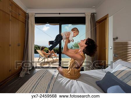 Mother and baby at home. View Large Photo Image Stock Photo - Mother and baby at home.. Fotosearch