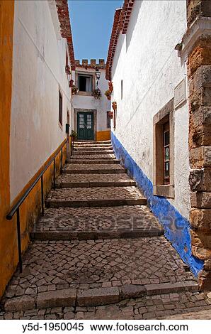 narrow street of Obidos, UNESCO heritage, Portugal. View Large Photo Image Stock Photography - narrow street of Obidos, UNESCO heritage, Portugal.. Fotosearch