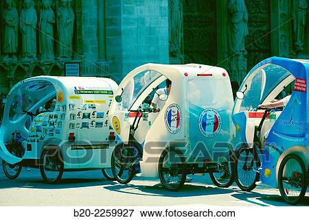 Stock Photo - Pedicab. Notre Dame Cathedral. Paris. France.. Fotosearch