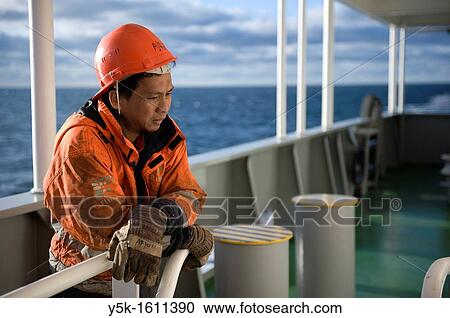 Portrait of an Indonesian seaman or sailor on the container-vessel MV Flintercape, during a journey from Rotterdam, Netherlands, to Sundsvall, Sweden. The man is an ´Able Seaman´, who generally works on deck. View Large Photo Image Stock Image - Portrait of an Indonesian seaman or sailor on the container-vessel MV Flintercape, during a journey from Rotterdam, Netherlands, to Sundsvall, Sweden. The man is an ´Able Seaman´, who generally works on deck.. Fotosearch