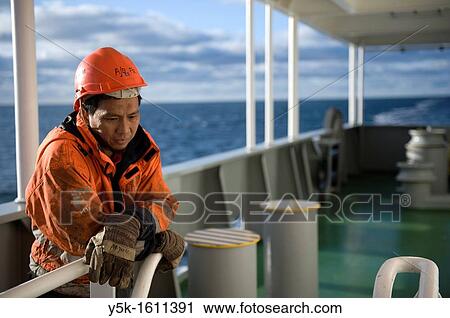 Portrait of an Indonesian seaman or sailor on the container-vessel MV Flintercape, during a journey from Rotterdam, Netherlands, to Sundsvall, Sweden. The man is an ´Able Seaman´, who generally works on deck. View Large Photo Image Stock Image - Portrait of an Indonesian seaman or sailor on the container-vessel MV Flintercape, during a journey from Rotterdam, Netherlands, to Sundsvall, Sweden. The man is an ´Able Seaman´, who generally works on deck.. Fotosearch