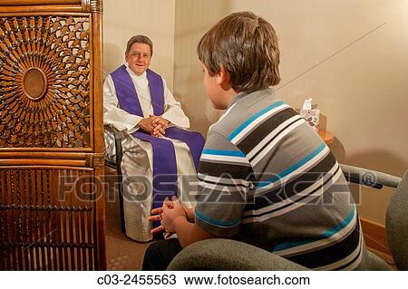Sitting face to face, a priest hears confession from a boy parishioner at a Laguna Niguel, CA, Catholic church. Note vestments. MODEL RELEASE. View Large Photo Image Stock Image - Sitting face to face, a priest hears confession from a boy parishioner at a Laguna Niguel, CA, Catholic church. Note vestments. MODEL RELEASE.. Fotosearch