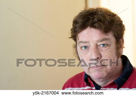 Studio Tuinstraat, Tilburg, Netherlands. Portrait of a 48 year old male photographer walking around his studio. View Large Photo Image Picture - Studio Tuinstraat, Tilburg, Netherlands. Portrait of a 48 year old male photographer walking around his studio.. Fotosearch