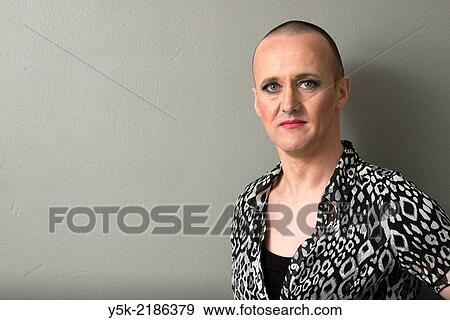 Stock Photo - Studio Tuinstraat, Tilburg, Netherlands. The 42 year old man, called: Â´BÂ´, regularly cross dresses himself as a woman. Wardrobe aswell as make up are done.. Fotosearch
