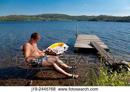 Summer cottage holiday brothers, Jämtland, Sweden water, reading View Large Photo Image Stock Photo - Summer cottage holiday brothers, Jämtland, Sweden water, reading. Fotosearch