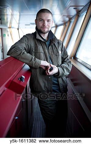 The second officer of container-vessel MV Flintercape controls the bridge of the vessel during absence of the captain and the first officer. The ship is sailing from Rotterdam, Netherlands to Sundsvall, Sweden. View Large Photo Image Stock Image - The second officer of container-vessel MV Flintercape controls the bridge of the vessel during absence of the captain and the first officer. The ship is sailing from Rotterdam, Netherlands to Sundsvall, Sweden.. Fotosearch