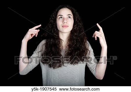 Tilburg, Netherlands Portrait of a young, brunette woman, making guestures indicating she is formulating an answer to a question View Large Photo Image Stock Photography - Tilburg, Netherlands Portrait of a young, brunette woman, making guestures indicating she is formulating an answer to a question. Fotosearch