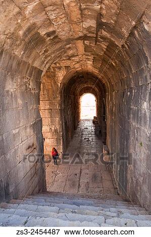 Tourist inside the ruins on a passageway leading to the ancient amphitheater of Miletus, Milet, Aydin Province, Turkey, Europe. View Large Photo Image Stock Photo - Tourist inside the ruins on a passageway leading to the ancient amphitheater of Miletus, Milet, Aydin Province, Turkey, Europe.. Fotosearch