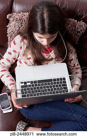 Young girl, 12 years old on laptop computer View Large Photo Image Stock Image - Young girl, 12 years old on laptop computer. Fotosearch