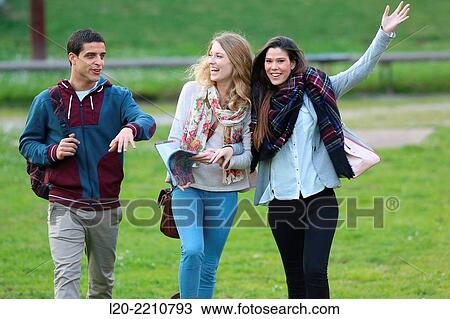 Stock Image - Young students at campus. Fotosearch