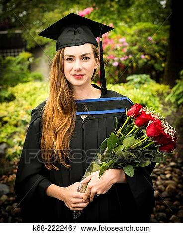 A 22 year old woman in a portrait on her university graduation day. View Large Photo Image Stock Photo - A 22 year old woman in a portrait on her university graduation day.. Fotosearch