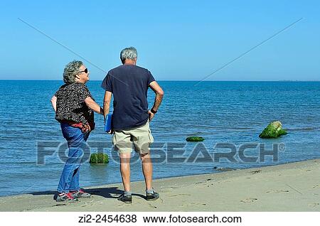 Stock Photo - A couple on the beach. Ebro Delta Natural Park. Tarragona, Spain. Fotosearch