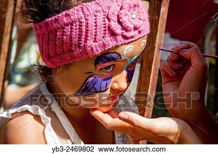 A Mixed Race (Anglo Thai) Child Has her Face Painted, Kingston Village Fete, Kingston, Sussex, UK. View Large Photo Image Stock Image - A Mixed Race (Anglo Thai) Child Has her Face Painted, Kingston Village Fete, Kingston, Sussex, UK.. Fotosearch